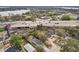 An aerial view showing real estate in a bustling locale near an elevated highway with glimpses of nearby lake at 2206 W Pine St, Orlando, FL 32805