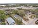 An aerial view of houses under a highway overpass by the lake showcases a unique urban living environment at 2206 W Pine St, Orlando, FL 32805