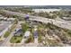 Aerial view of a single Gathering home and neighborhood near a highway and lake at 2206 W Pine St, Orlando, FL 32805