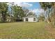 View of the backyard showing the exterior with white siding at 2206 W Pine St, Orlando, FL 32805