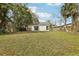 View of the backyard showing the exterior with white siding at 2206 W Pine St, Orlando, FL 32805