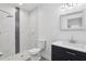 Modern bathroom featuring a walk-in shower, vanity with sink, and toilet at 2206 W Pine St, Orlando, FL 32805