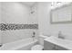 Bathroom featuring a tub, shower, toilet, and vanity with sink at 2206 W Pine St, Orlando, FL 32805