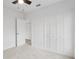 Bedroom featuring carpet, ceiling fan, closet, and doorway at 2206 W Pine St, Orlando, FL 32805