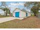 Charming home featuring a blue garage door and a well-maintained front yard at 2206 W Pine St, Orlando, FL 32805