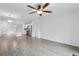 Open-concept living area with modern flooring, recessed lighting, and seamless transition to the kitchen at 2206 W Pine St, Orlando, FL 32805