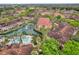 Stunning aerial view of a waterfront community with a pool, beautiful landscaping, and serene water features at 2314 Arbor Lakes Cir # 1, Sanford, FL 32771