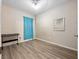 Bedroom with wood-look floors, a window, and an overhead light fixture with fan at 2336 Caravelle Cir, Kissimmee, FL 34746