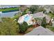 Aerial shot of the pool featuring a large pool, spa, playground, and ample seating with a lake nearby at 2336 Caravelle Cir, Kissimmee, FL 34746