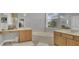 Bathroom featuring double vanities, a soaking tub, and natural light from a large window at 23431 Companero Dr, Sorrento, FL 32776