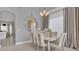 Dining room with elegant wall decor, neutral tones, and lots of natural light at 23431 Companero Dr, Sorrento, FL 32776