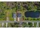 Aerial view of the property, showcasing its location near a tranquil pond at 2875 E Slater Dr, Deltona, FL 32738