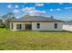 Home's backyard featuring a well-maintained lawn at 2875 E Slater Dr, Deltona, FL 32738