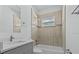 Updated bathroom with a modern vanity, neutral tiling, and a shower-tub combo at 2875 E Slater Dr, Deltona, FL 32738