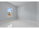 Bright bedroom with white tile flooring and a large window at 2875 E Slater Dr, Deltona, FL 32738