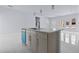 Kitchen island featuring modern sink and faucet, along with gray cabinets at 2875 E Slater Dr, Deltona, FL 32738