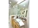 Bathroom with granite counters, large mirror, and walk-in shower at 3050 Pirates Retreat Ct # 103, Kissimmee, FL 34747