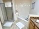 Bathroom with enclosed shower and soaking tub at 3050 Pirates Retreat Ct # 103, Kissimmee, FL 34747