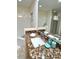 Bathroom features granite counters, tub, and glass enclosed shower at 3050 Pirates Retreat Ct # 103, Kissimmee, FL 34747