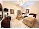 Bedroom featuring two twin beds, tile floors and a dresser at 3050 Pirates Retreat Ct # 103, Kissimmee, FL 34747