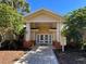 Exterior of Clubhouse with covered entrance and signage at 3050 Pirates Retreat Ct # 103, Kissimmee, FL 34747