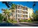 Beautiful three-story condo building with screened patios and lush landscaping and ample parking at 3050 Pirates Retreat Ct # 103, Kissimmee, FL 34747