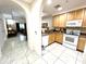 Bright kitchen with granite counters and modern appliances at 3050 Pirates Retreat Ct # 103, Kissimmee, FL 34747