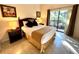 Main bedroom features tile floors and a sliding glass door at 3050 Pirates Retreat Ct # 103, Kissimmee, FL 34747