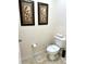 Toilet room with tile floors and decorative wall art at 3050 Pirates Retreat Ct # 103, Kissimmee, FL 34747