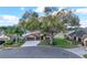 Aerial view of home on landscaped lot showcasing curb appeal and neighborhood setting at 32107 Spring Meadow Ct., Sorrento, FL 32776