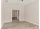 Neutral bedroom with wood floors leading to other rooms of the home at 32107 Spring Meadow Ct., Sorrento, FL 32776