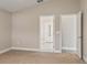 Neutral bedroom with carpet, featuring doorways to a hall and the attached bathroom at 32107 Spring Meadow Ct., Sorrento, FL 32776