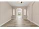 Open living room featuring hardwood floors, archways, and a ceiling fan at 32107 Spring Meadow Ct., Sorrento, FL 32776