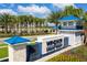 Inviting entrance to Windsor Island Resort with a blue-accented monument sign and well-maintained landscaping at 3312 Lilac Wa, Davenport, FL 33897