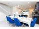 Inviting dining area with seating for six, adjacent to a modern kitchen and stairs leading to the second floor at 3312 Lilac Wa, Davenport, FL 33897