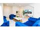 Cozy living room featuring comfortable blue seating, a mounted TV, and a console table with decorative mirror at 3312 Lilac Wa, Davenport, FL 33897