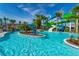 Sprawling pool area with lush landscaping and colorful water slides, promising endless water fun at 3312 Lilac Wa, Davenport, FL 33897