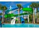 Exciting water slides cascading into a refreshing pool, perfect for Gathering fun in the sun at 3312 Lilac Wa, Davenport, FL 33897