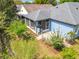 Aerial view of the backyard with a screened-in lanai, landscaping, and room for entertaining at 4020 Shawn Cir, Orlando, FL 32826