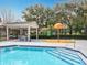 A clear swimming pool and a splash pad are featured in this community recreation area at 4020 Shawn Cir, Orlando, FL 32826