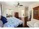 Comfortable main bedroom with an en-suite bathroom, closet, and study or sitting area at 4020 Shawn Cir, Orlando, FL 32826