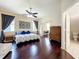 The main bedroom boasts wood floors, an en-suite bathroom, and a study area at 4020 Shawn Cir, Orlando, FL 32826