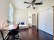 Office space with hardwood floors, ceiling fan, desk, sofa and closet for storage at 4020 Shawn Cir, Orlando, FL 32826