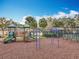 A fully-equipped playground featuring slides, swings, and climbing structures in a fenced area at 4020 Shawn Cir, Orlando, FL 32826