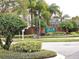 Community entrance sign for Tanner Crossings amid lush landscaping and palm trees, welcoming visitors at 4020 Shawn Cir, Orlando, FL 32826