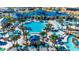 Aerial view of community pool with cabanas and lounge chairs for relaxation at 4058 Lana Avenue, Davenport, FL 33897