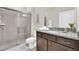 Bathroom featuring a shower, granite countertops, and modern cabinets at 4058 Lana Avenue, Davenport, FL 33897