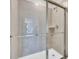 Modern bathroom featuring a glass-enclosed shower and a sleek design at 4058 Lana Avenue, Davenport, FL 33897