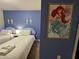 Charming bedroom with twin beds, seahorse wall decor, and an Ariel-themed poster at 4058 Lana Avenue, Davenport, FL 33897