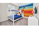 Fun bedroom featuring a bunk bed and a vibrant Mickey Mouse wall mural at 4058 Lana Avenue, Davenport, FL 33897